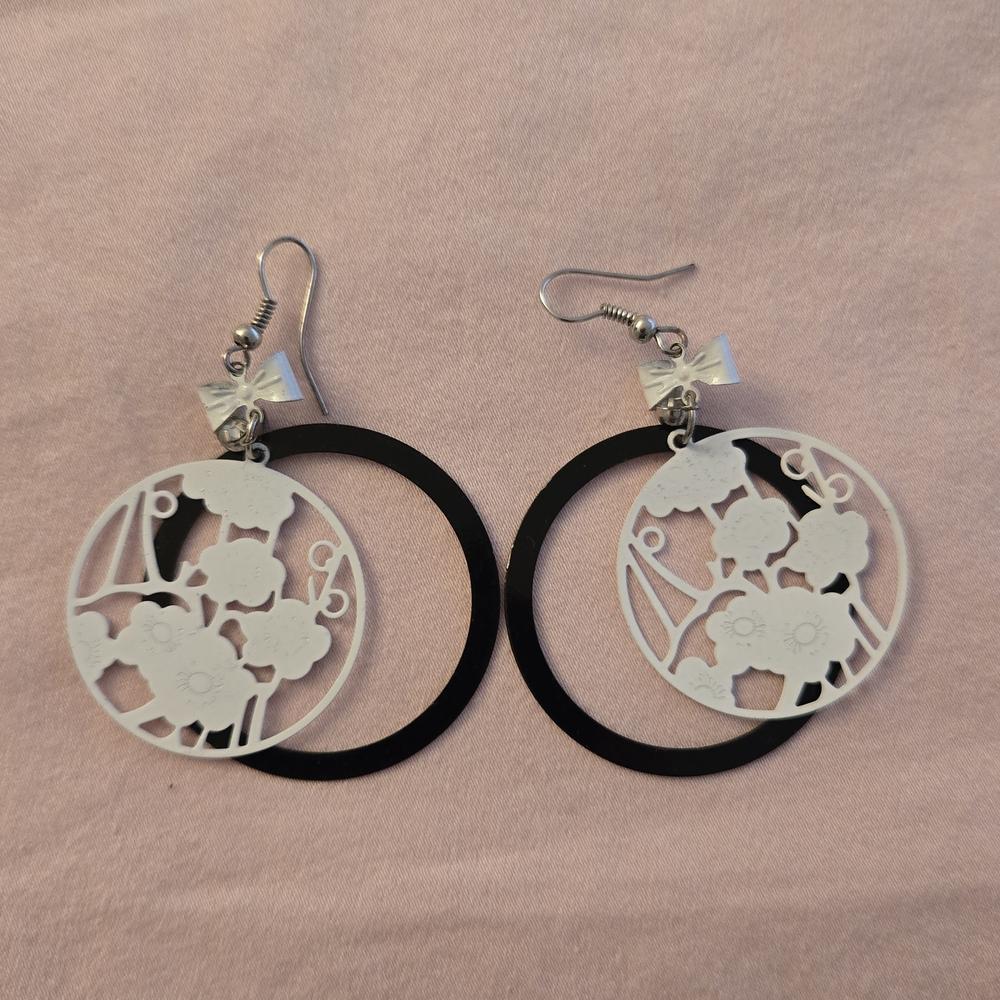 Black and White Dangle Earrings With Bow And Intricate Floral Designs